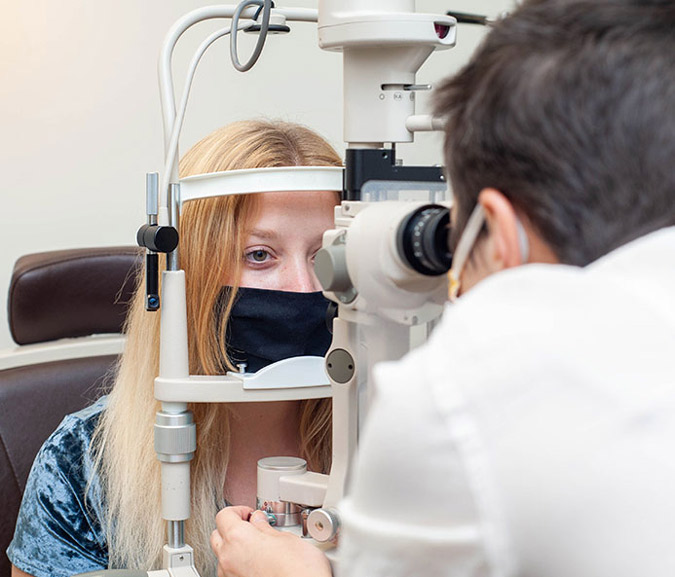 Woman getting comprehensive Eye exam in Winston-Salem