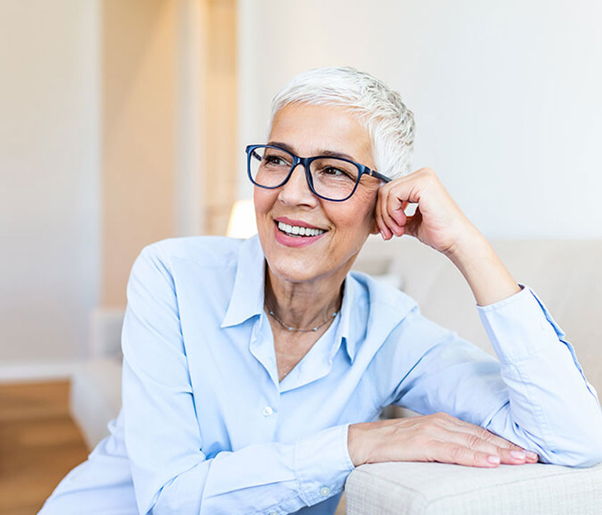 Woman with glasses after cataract surgery