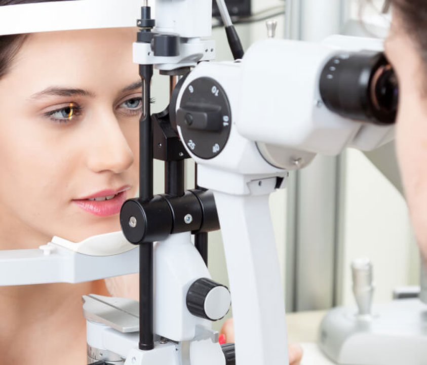 Woman taking contact lens exam