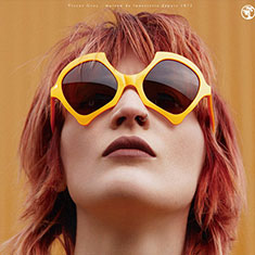 Woman wearing orange sunglasses from C Eyewear